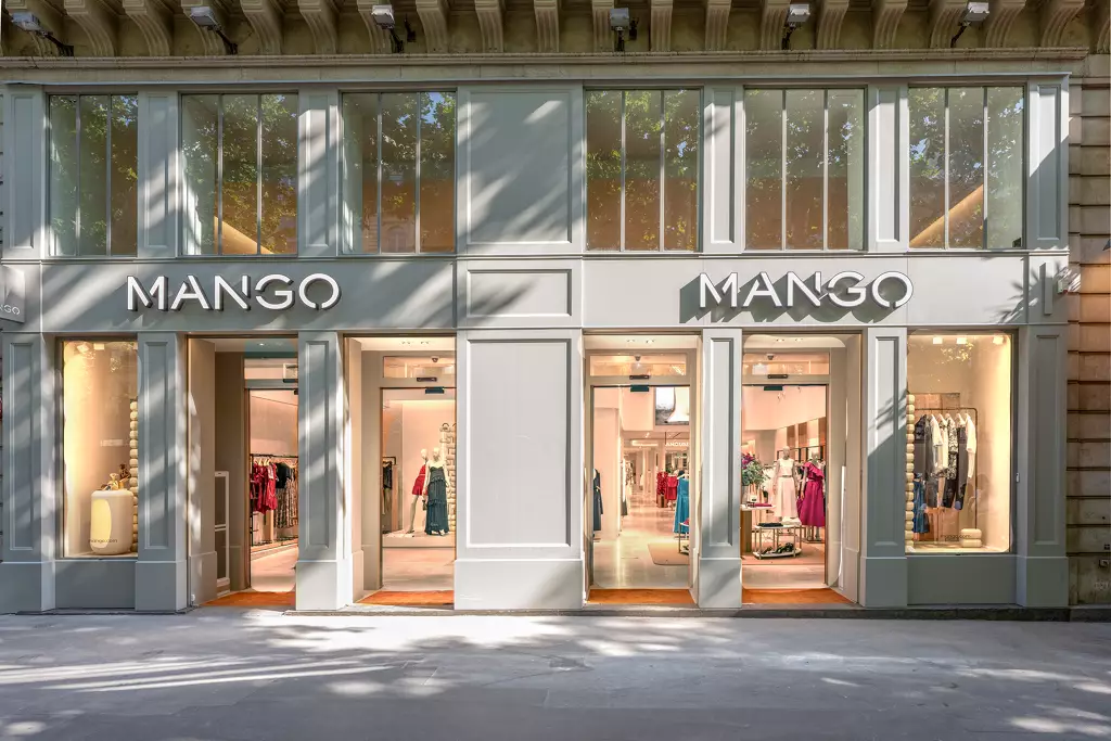 A Mango flagship storefront in France, twin entrances with the Mango wordmark above each door